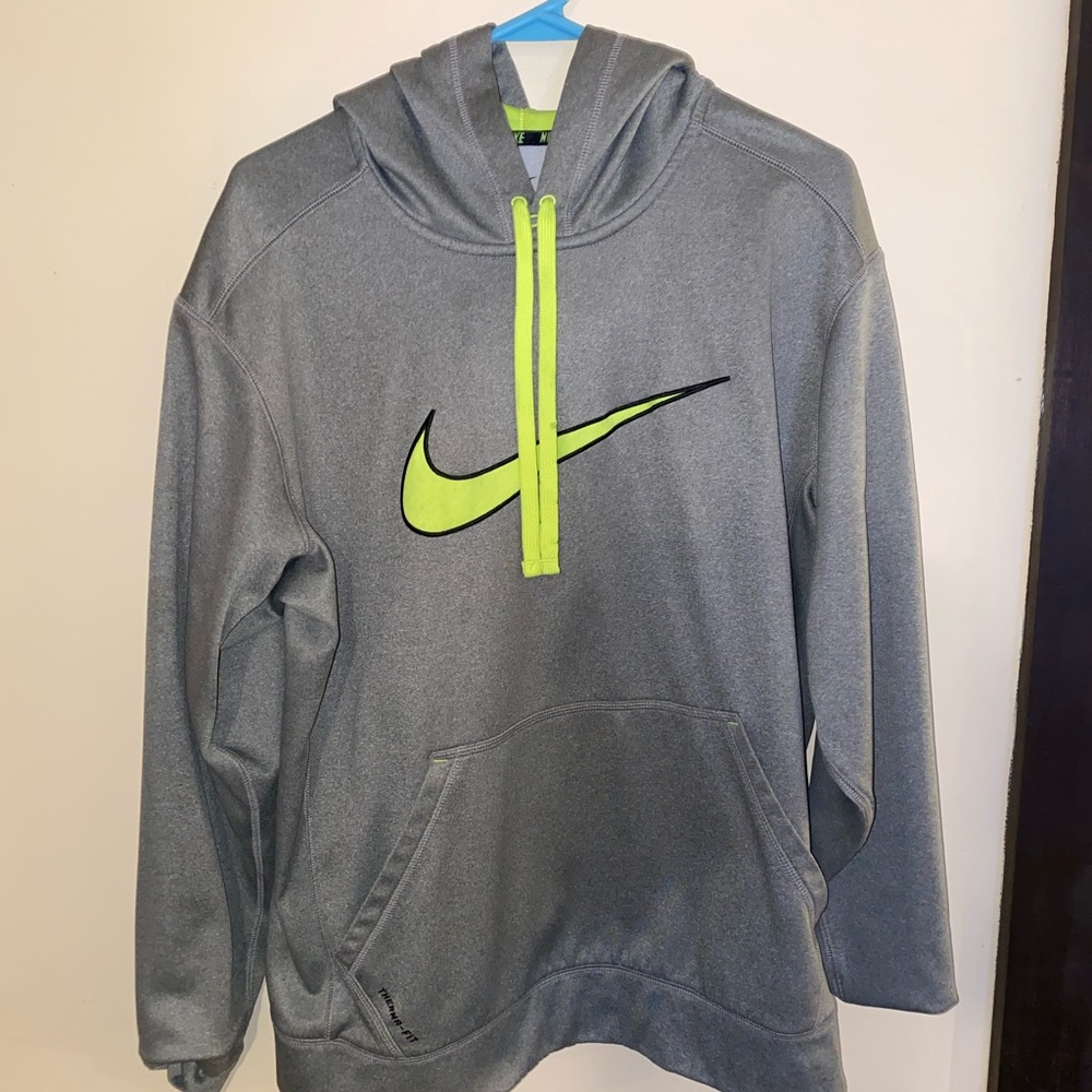 Gray Nike hoodie with neon green nike logo